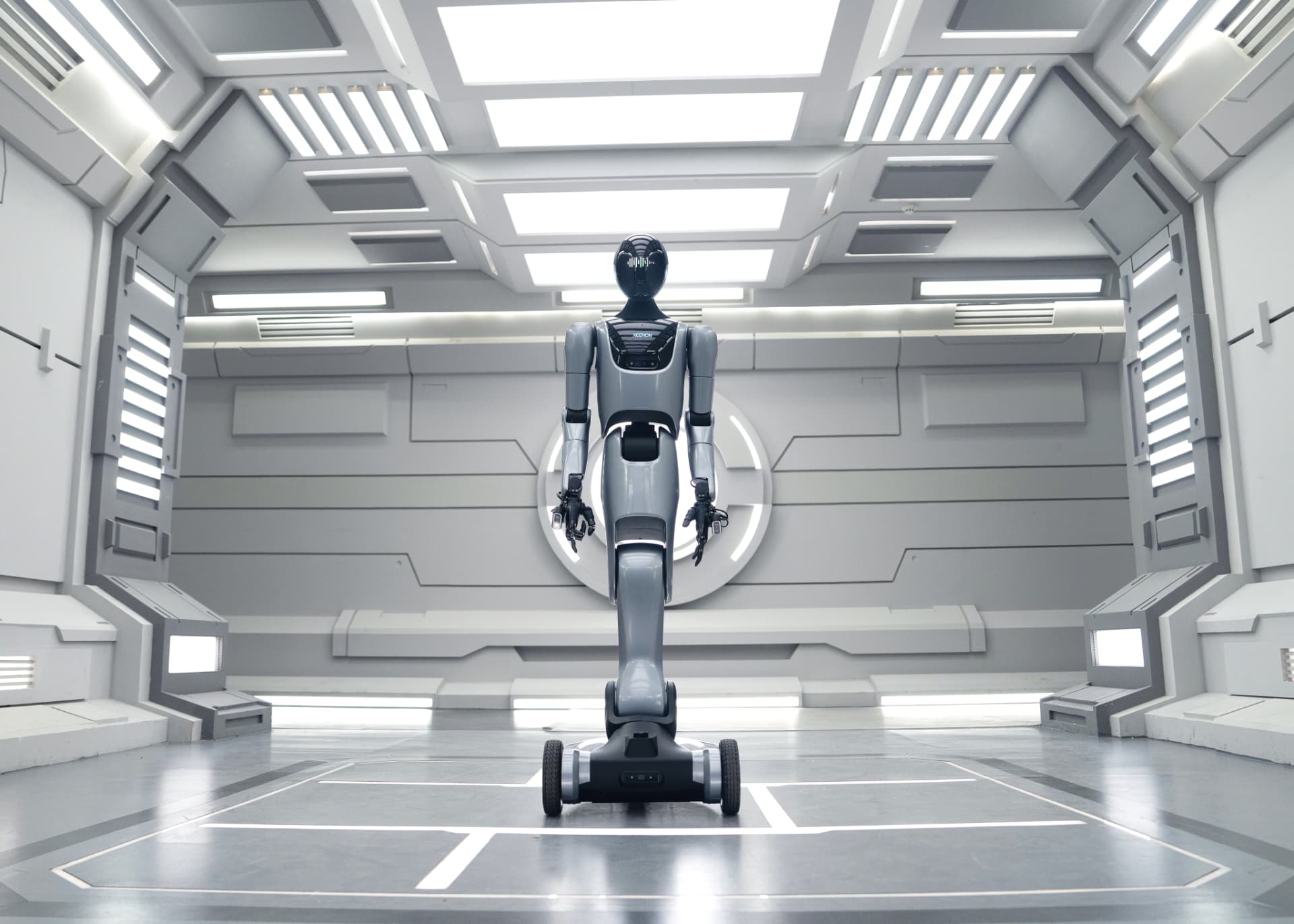 KEENON XMAN-R1 humanoid service robot showing its stable wheeled mobile base