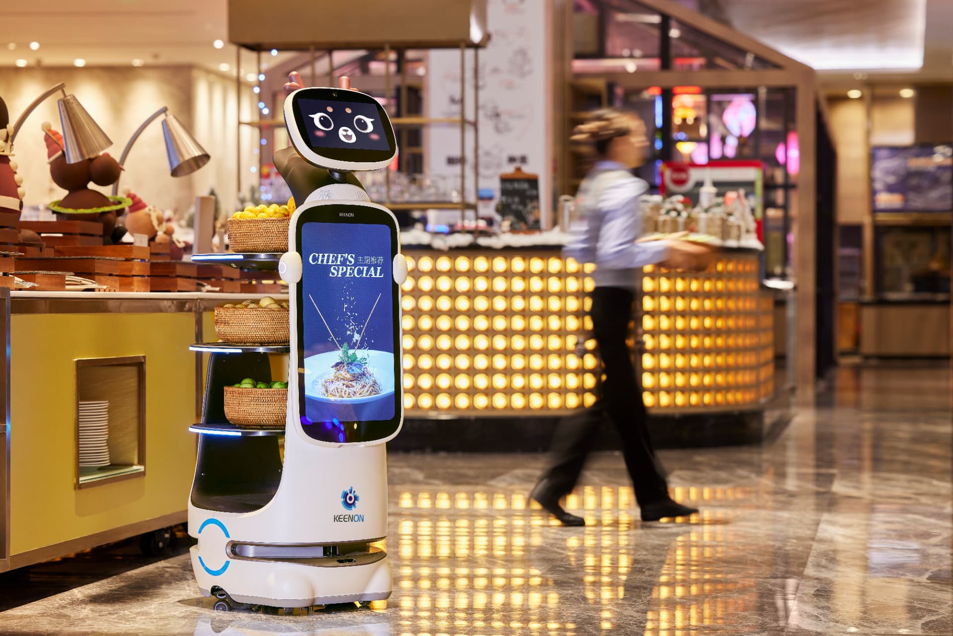 Keenon Dinerbot T10 delivering orders in a modern cafe with menu promotions on the display