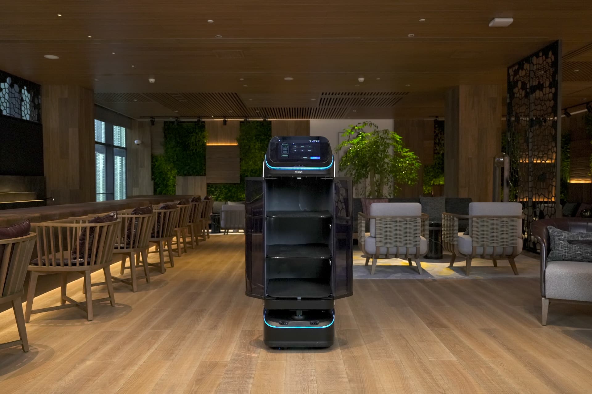 Keenon DINERBOT T3 with its enclosed delivery compartments open, showing three shelves