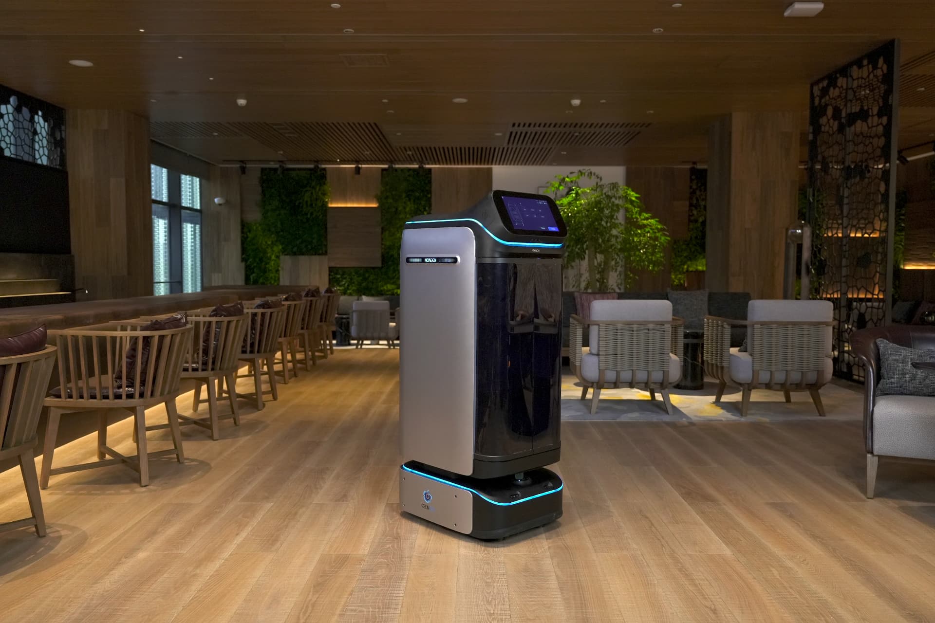 Keenon DINERBOT T3 with touchscreen in a hotel lounge and restaurant area